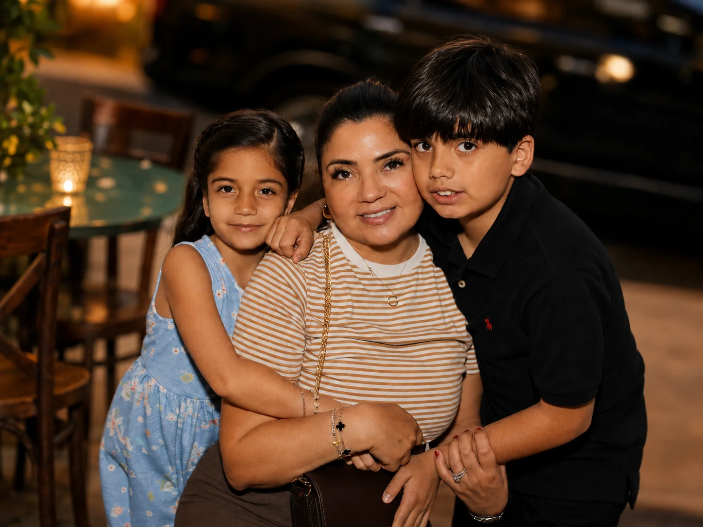 An adult and two children embracing for a restaurant portrait at The Ox Tavern at Westwood
